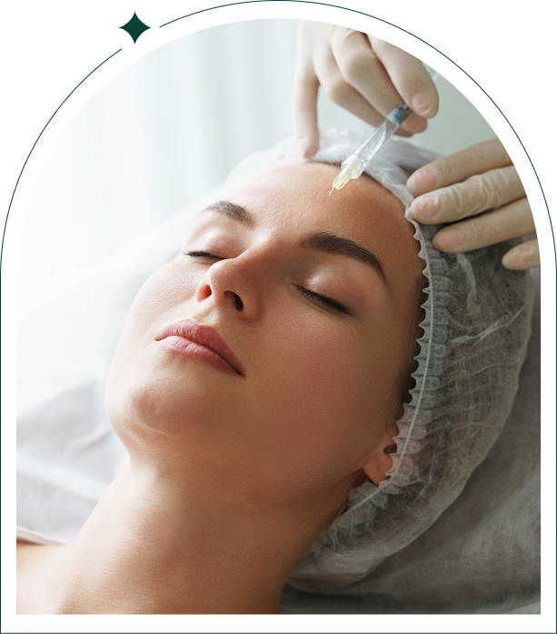 Woman receiving forehead cosmetic injection