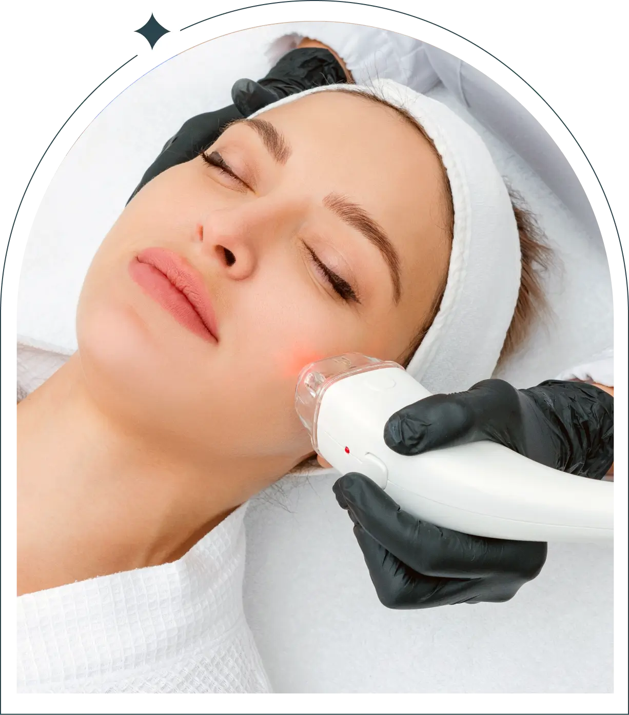 Woman receiving red-light facial skin treatment